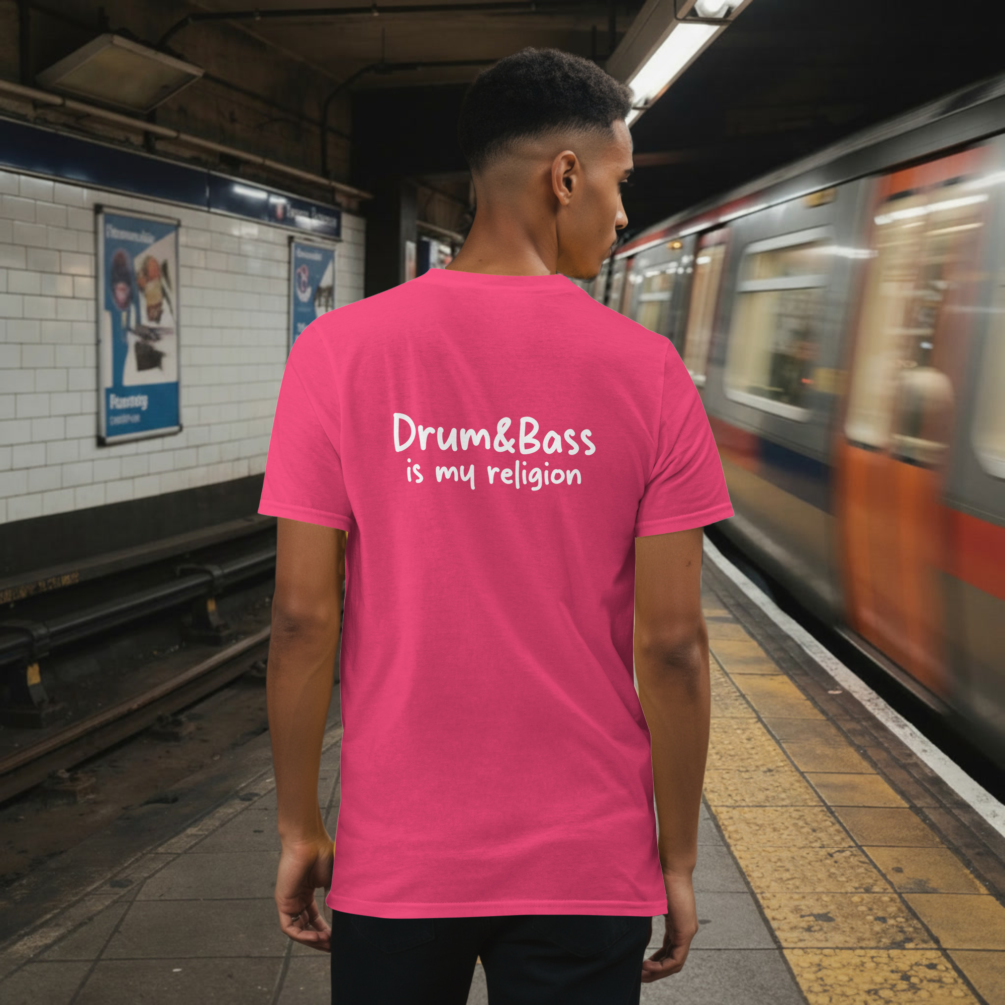 Model wearing a Unisex t-shirt with bold, geometric Funky Jaysus illustration on the front and “Drum & Bass is my religion” slogan on the back. A statement piece for DnB fans and streetwear lovers.