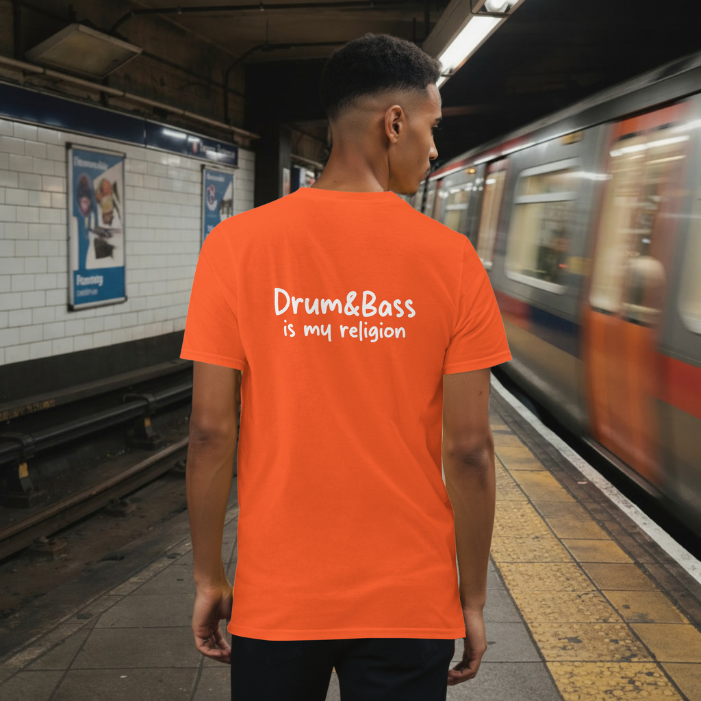 Model wearing a Unisex t-shirt with bold, geometric Funky Jaysus illustration on the front and “Drum & Bass is my religion” slogan on the back. A statement piece for DnB fans and streetwear lovers.