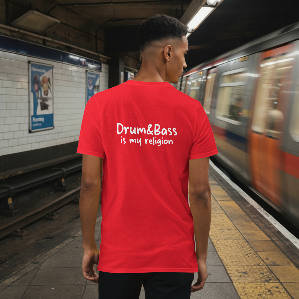 Model wearing a Unisex t-shirt with bold, geometric Funky Jaysus illustration on the front and “Drum & Bass is my religion” slogan on the back. A statement piece for DnB fans and streetwear lovers.