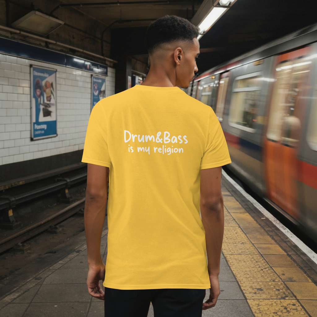 Model wearing a Unisex t-shirt with bold, geometric Funky Jaysus illustration on the front and “Drum & Bass is my religion” slogan on the back. A statement piece for DnB fans and streetwear lovers.