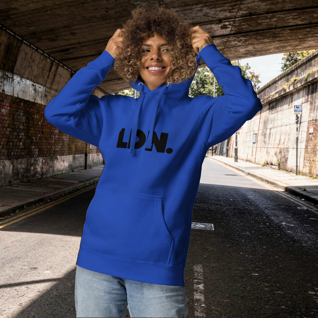 Unisex Hoodie - blue hoodie with tonal “LDN.” graphic worn by male model — soft fleece lining, relaxed streetwear silhouette, perfect for layering in cooler seasons.