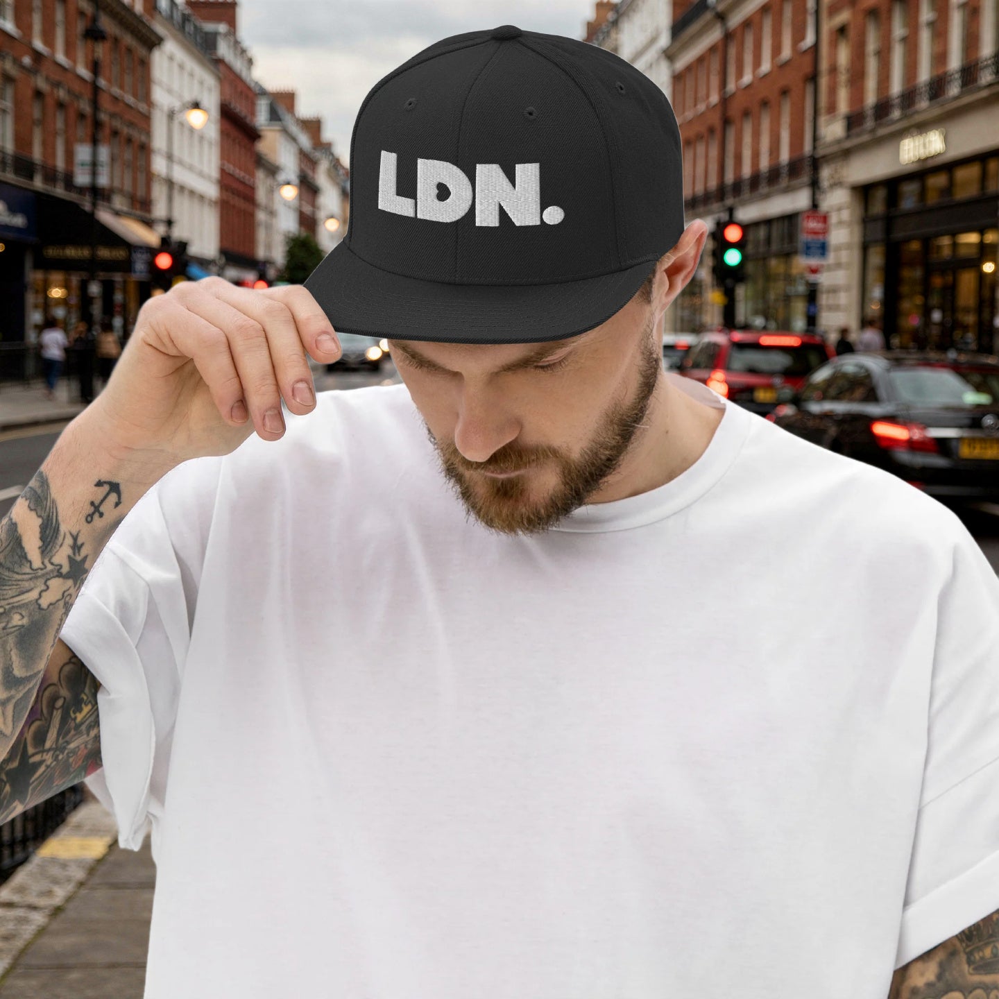 Black snapback hat featuring bold “LDN.” text in white — streetwear-ready with structured fit, flat brim, and adjustable back. A sharp urban essential for London lovers.