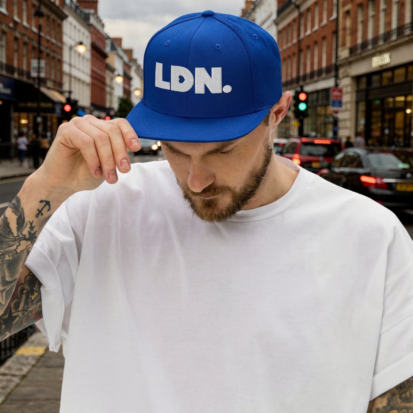 Royal Blue snapback hat featuring bold “LDN.” text in white — streetwear-ready with structured fit, flat brim, and adjustable back. A sharp urban essential for London lovers.