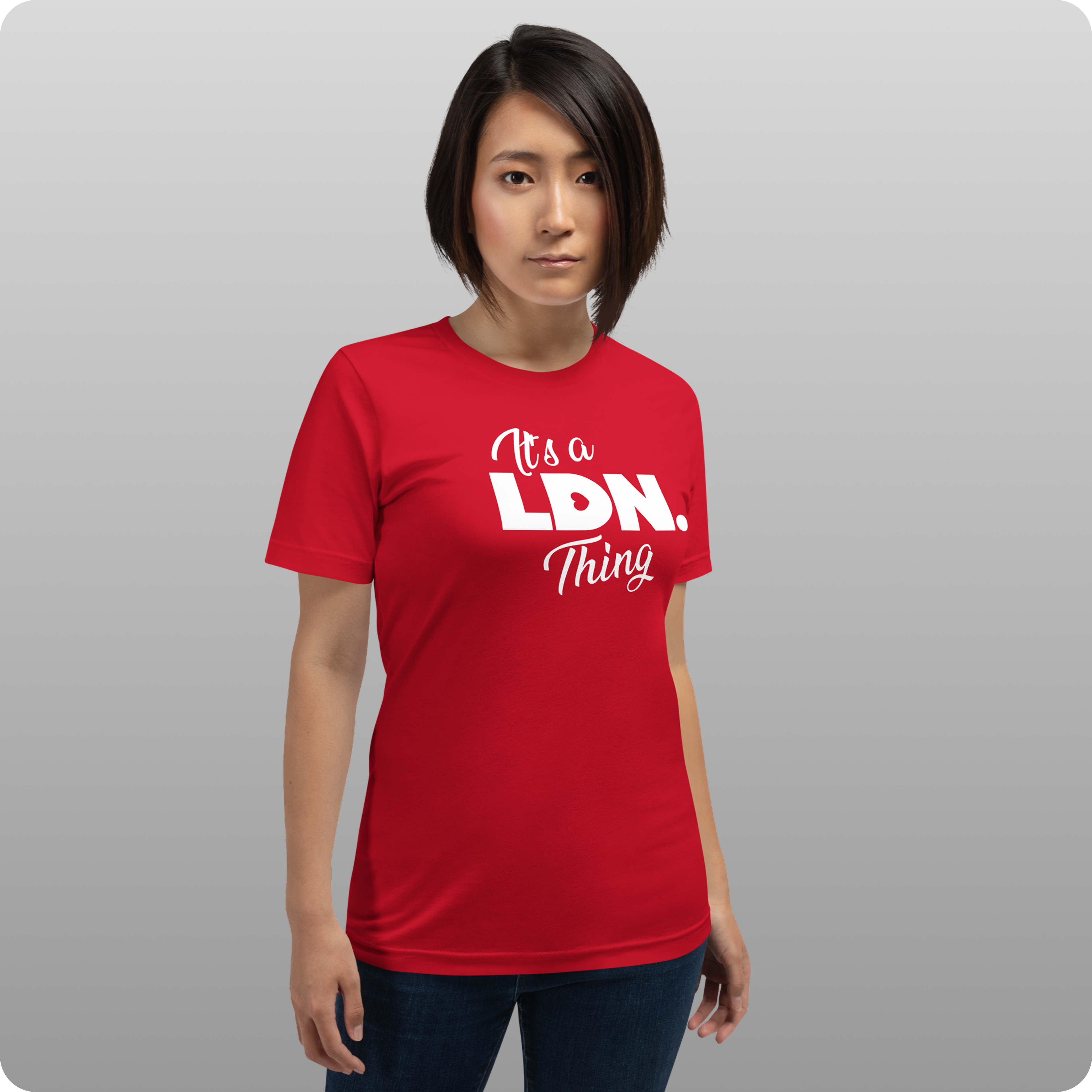 Person wearing a red t-shirt with text on a gray background