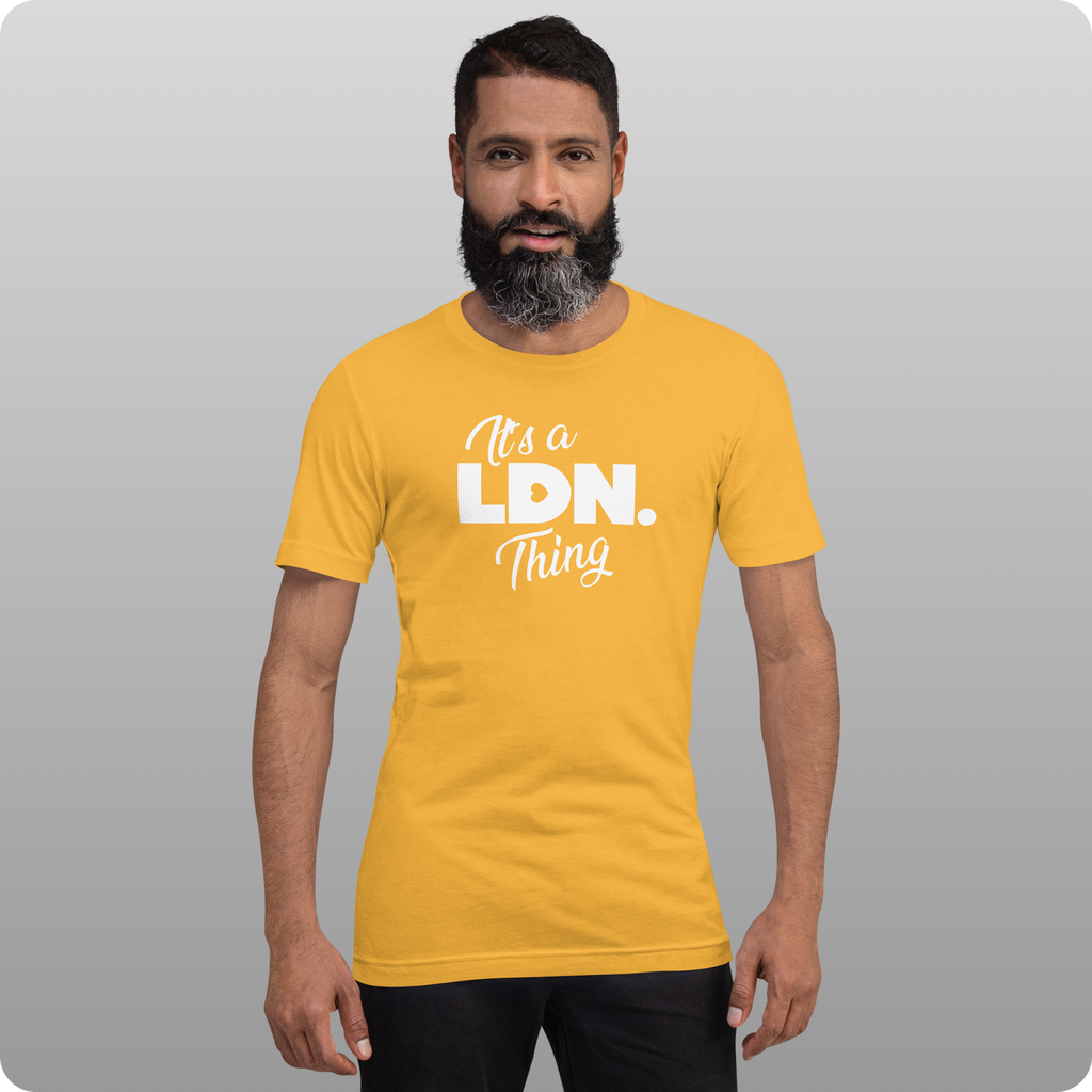 Man wearing a yellow t-shirt with 'It's a LDN Thing' text on a gray background