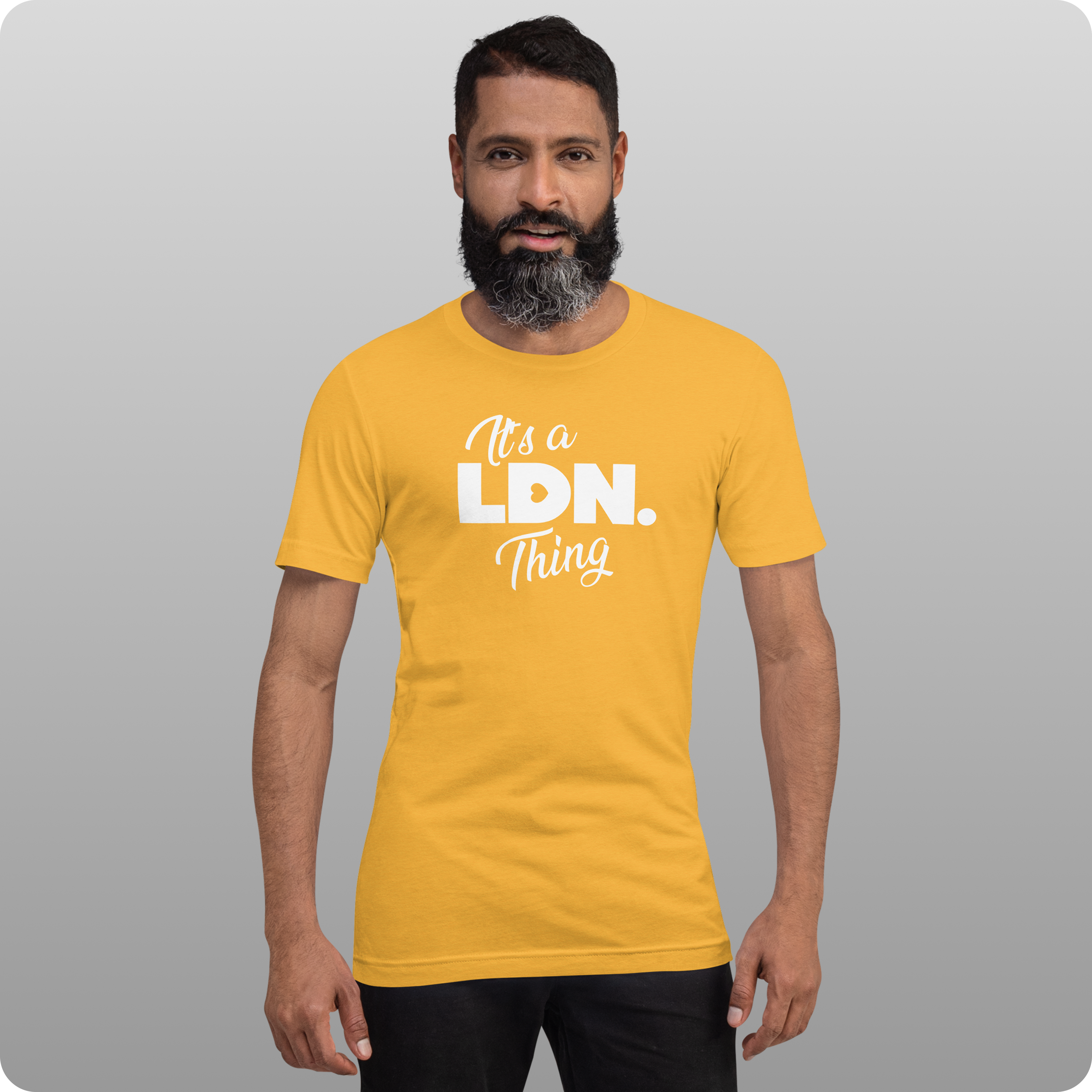 Man wearing a yellow t-shirt with 'It's a LDN Thing' text on a gray background