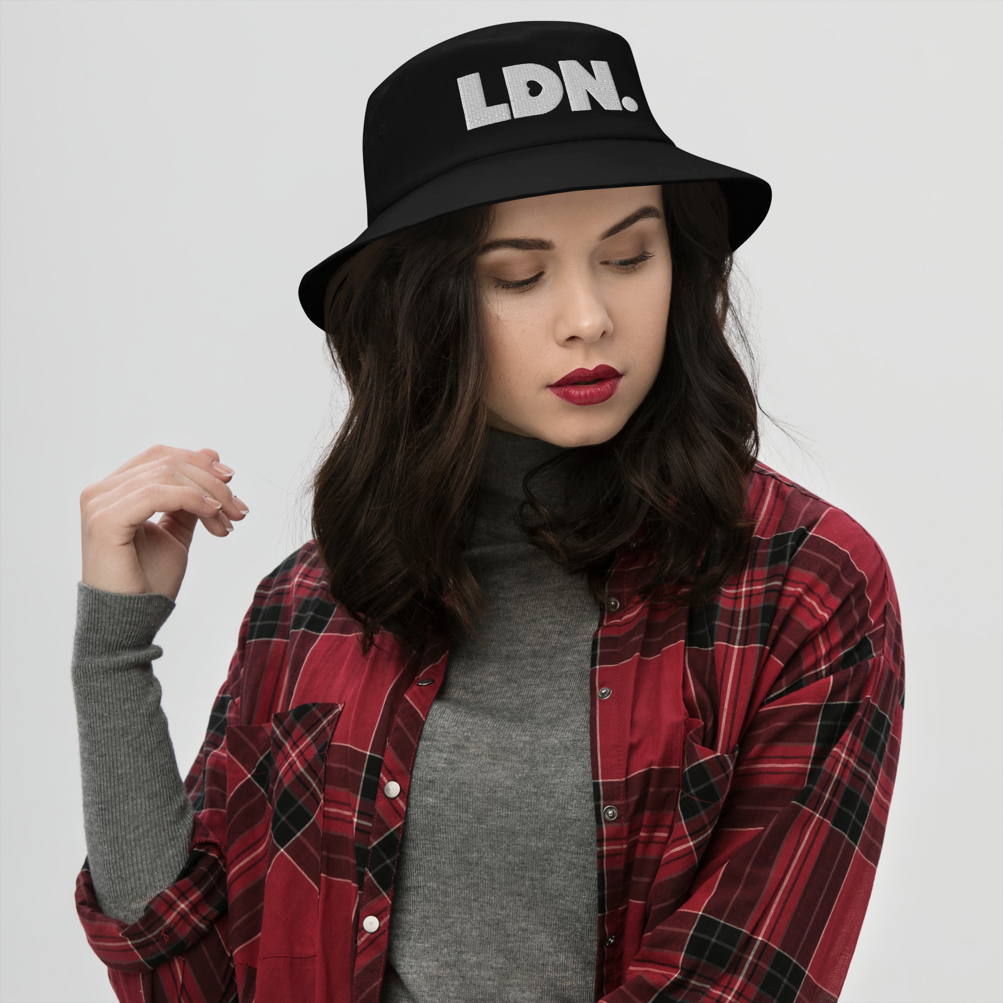 Bucket hat with bold embroidered LDN. logo on front. Features cotton twill fabric, breathable eyelets, and a relaxed wide brim. Ideal for everyday streetwear, summer outfits, or repping London in casual style.