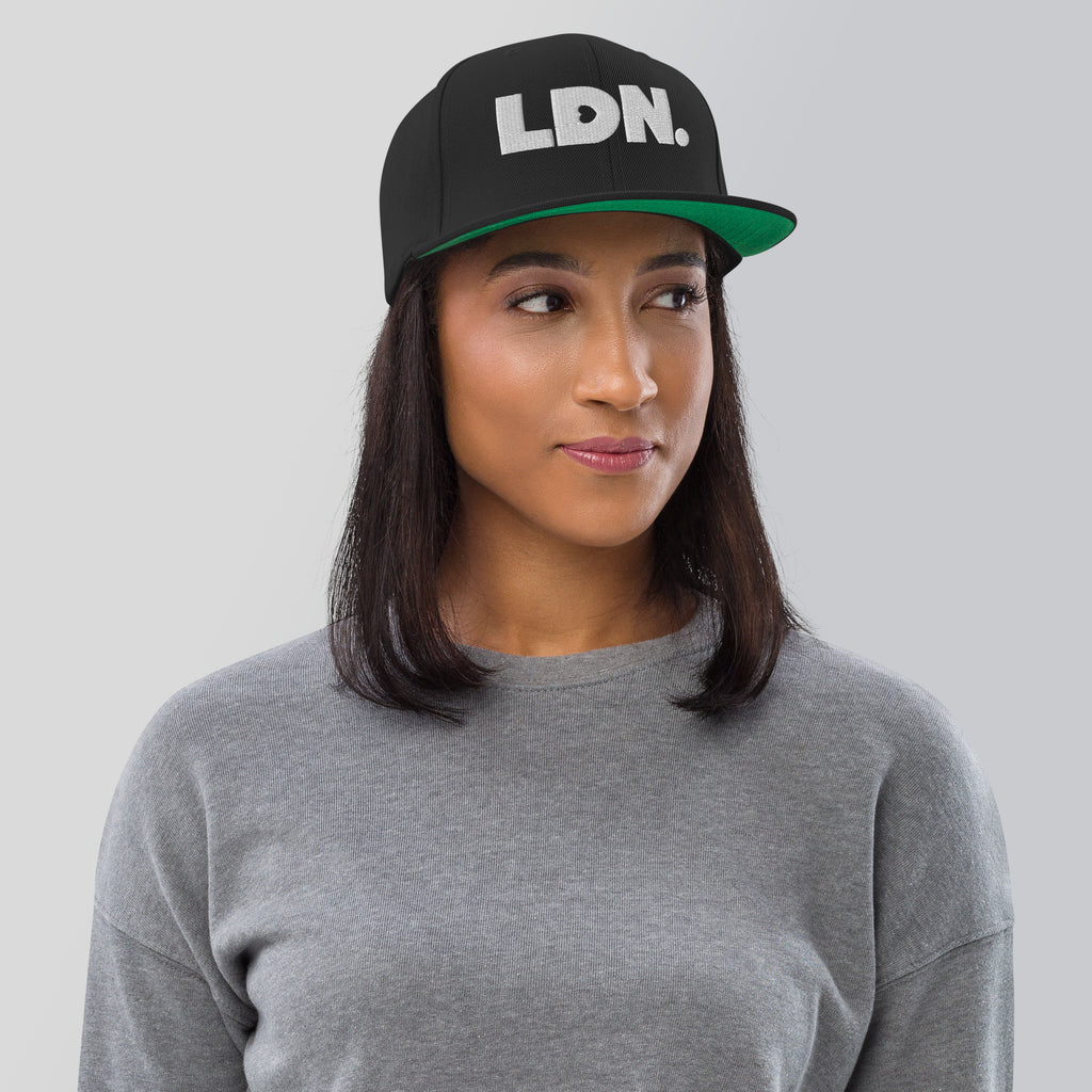 Black snapback hat featuring bold “LDN.” text in white — streetwear-ready with structured fit, flat brim, and adjustable back. A sharp urban essential for London lovers.