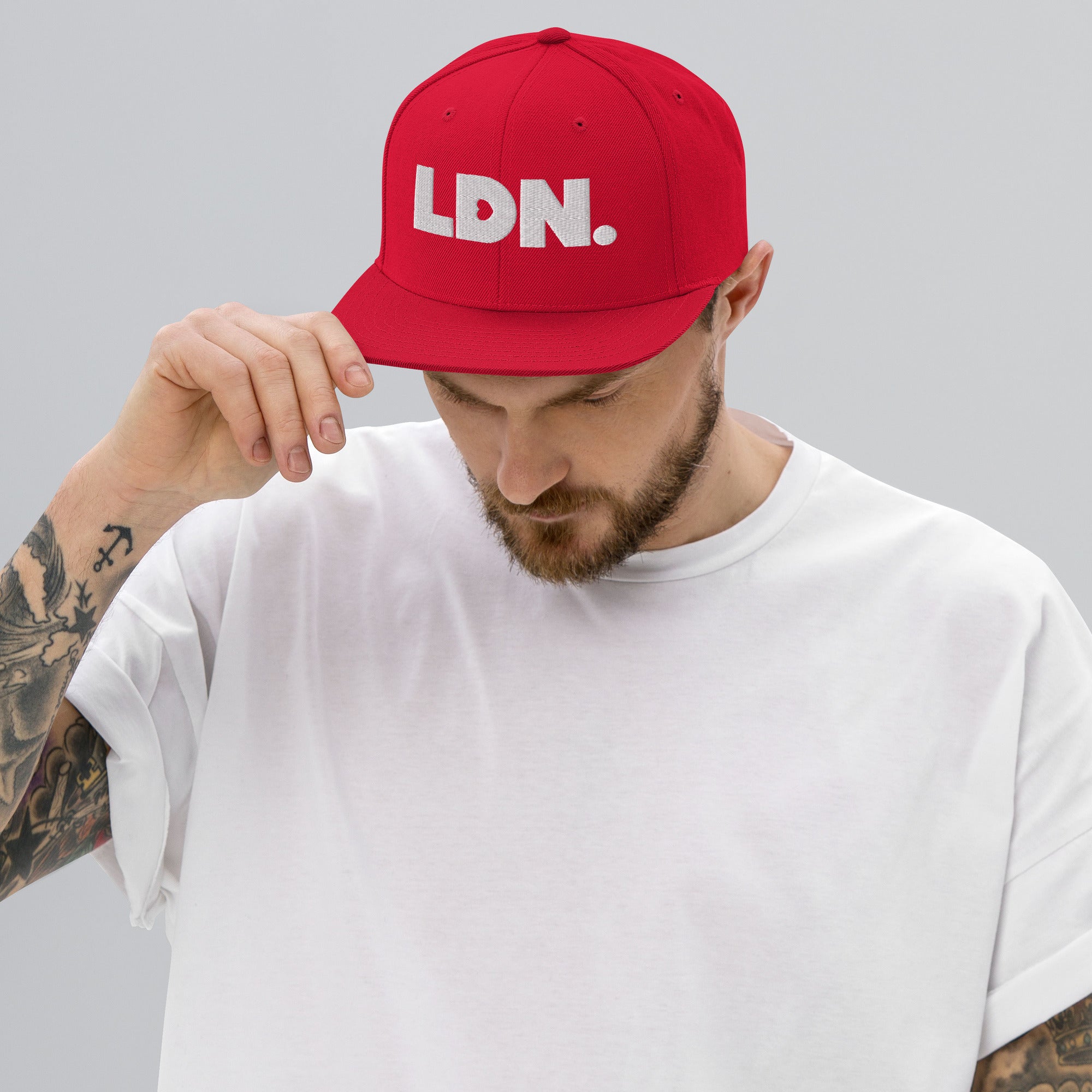 Black snapback hat featuring bold “LDN.” text in white — streetwear-ready with structured fit, flat brim, and adjustable back. A sharp urban essential for London lovers.