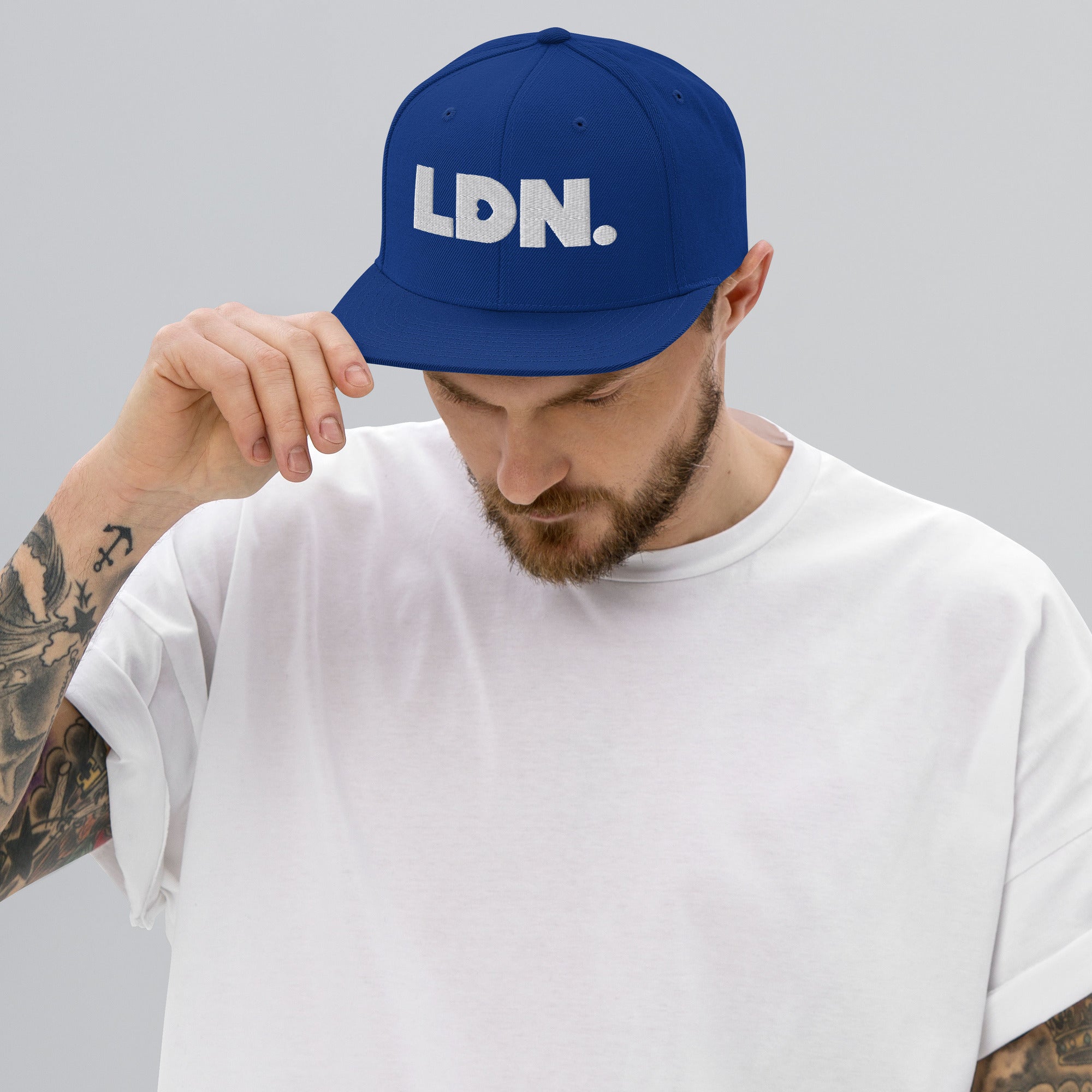Black snapback hat featuring bold “LDN.” text in white — streetwear-ready with structured fit, flat brim, and adjustable back. A sharp urban essential for London lovers.
