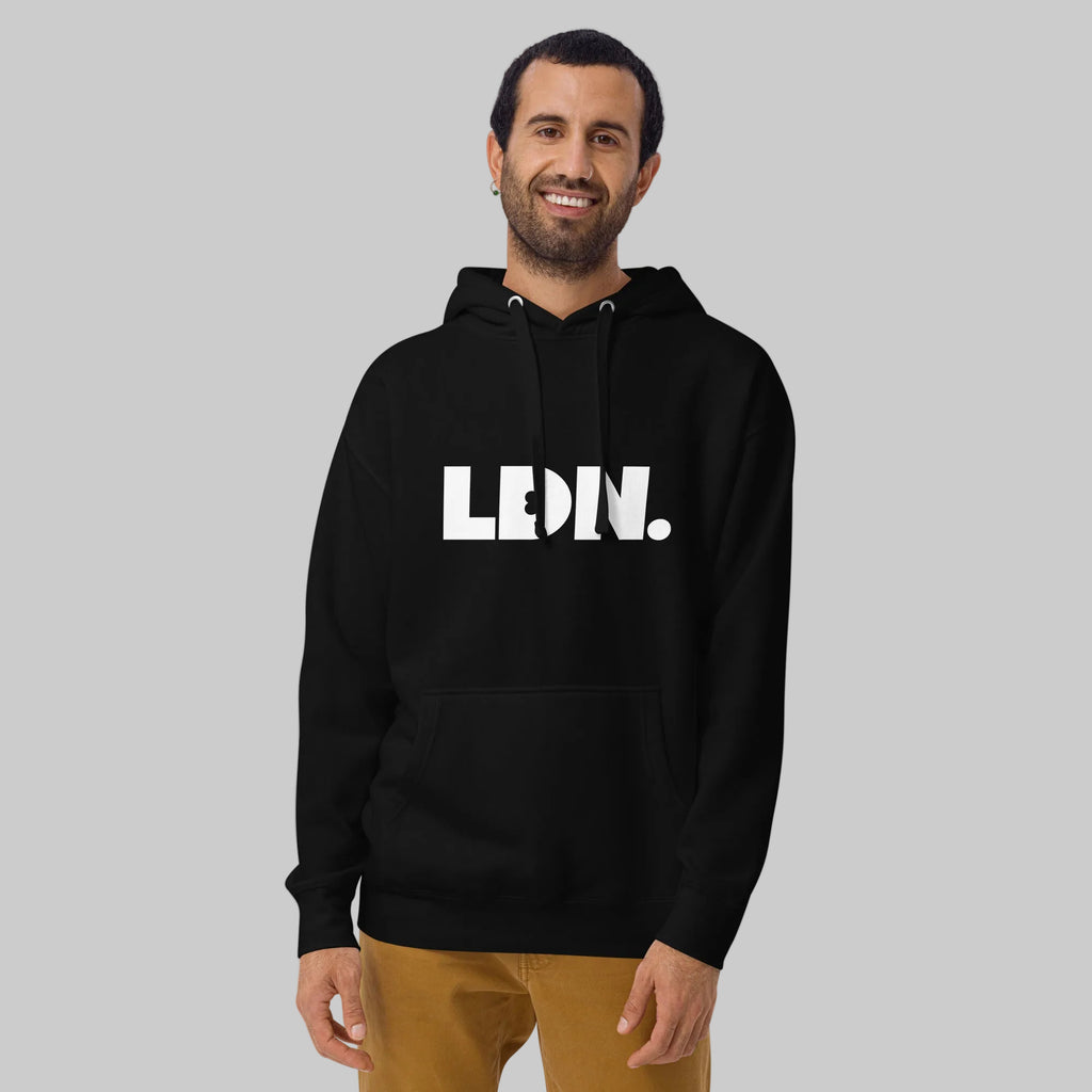 Unisex Hoodie - hoodie with white “LDN.” graphic worn by male model — soft fleece lining, relaxed streetwear silhouette, perfect for layering in cooler seasons.
