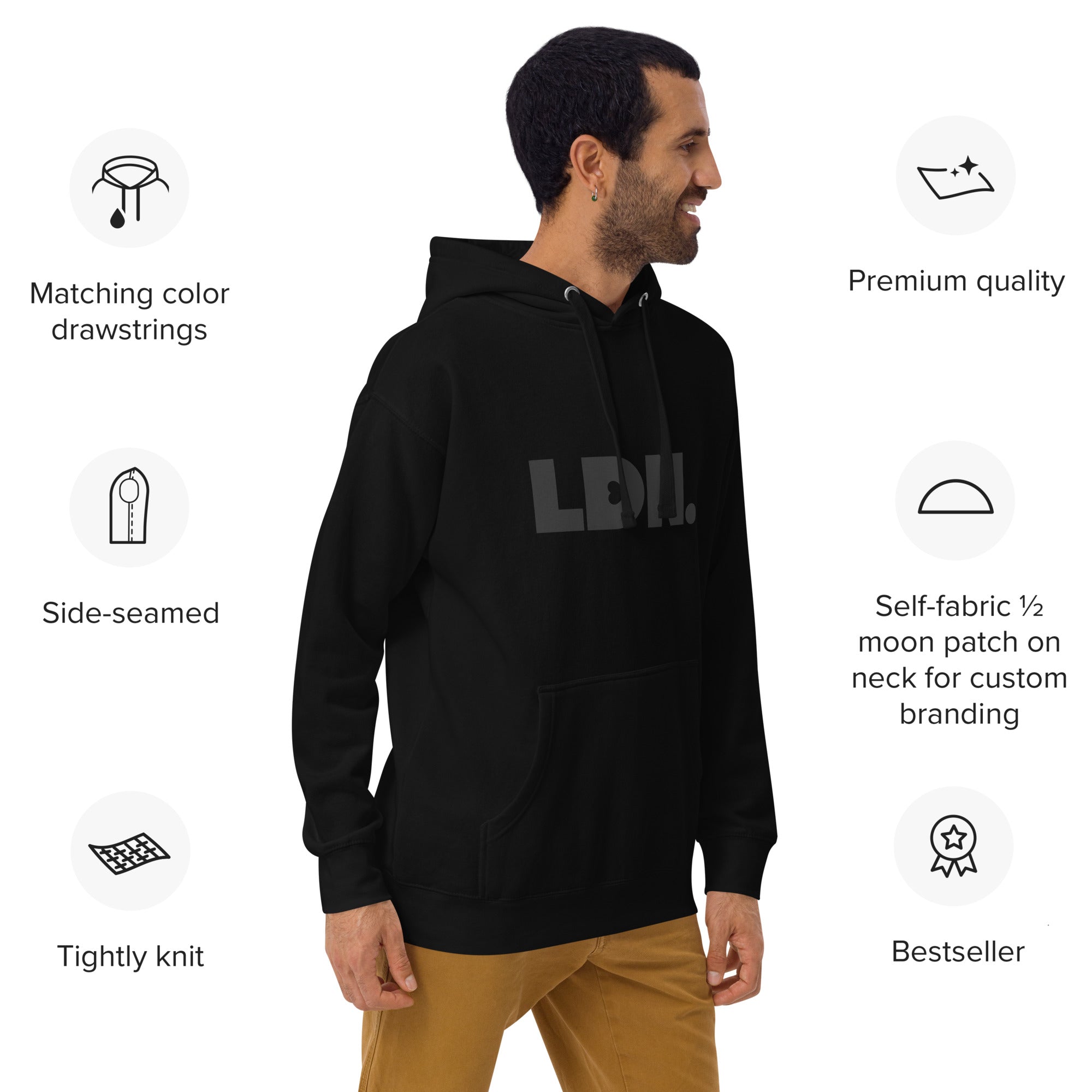 Unisex Hoodie - Black hoodie with tonal “LDN.” graphic worn by male model — soft fleece lining, relaxed streetwear silhouette, perfect for layering in cooler seasons.