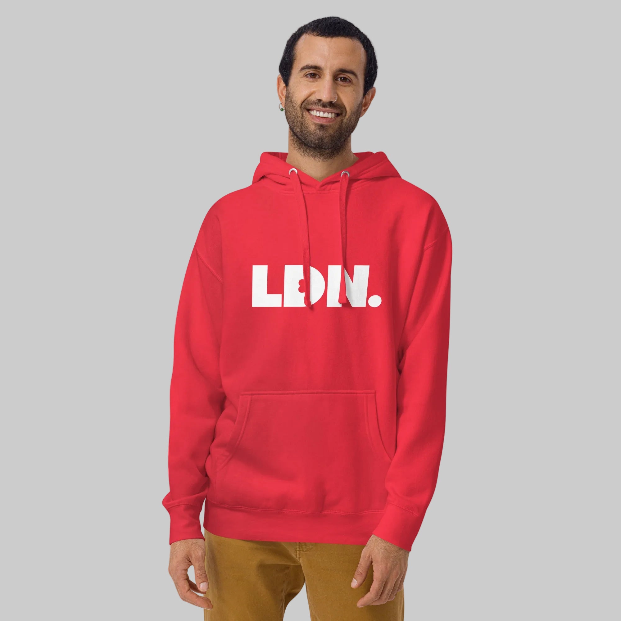 Unisex Hoodie - hoodie with white “LDN.” graphic worn by male model — soft fleece lining, relaxed streetwear silhouette, perfect for layering in cooler seasons.