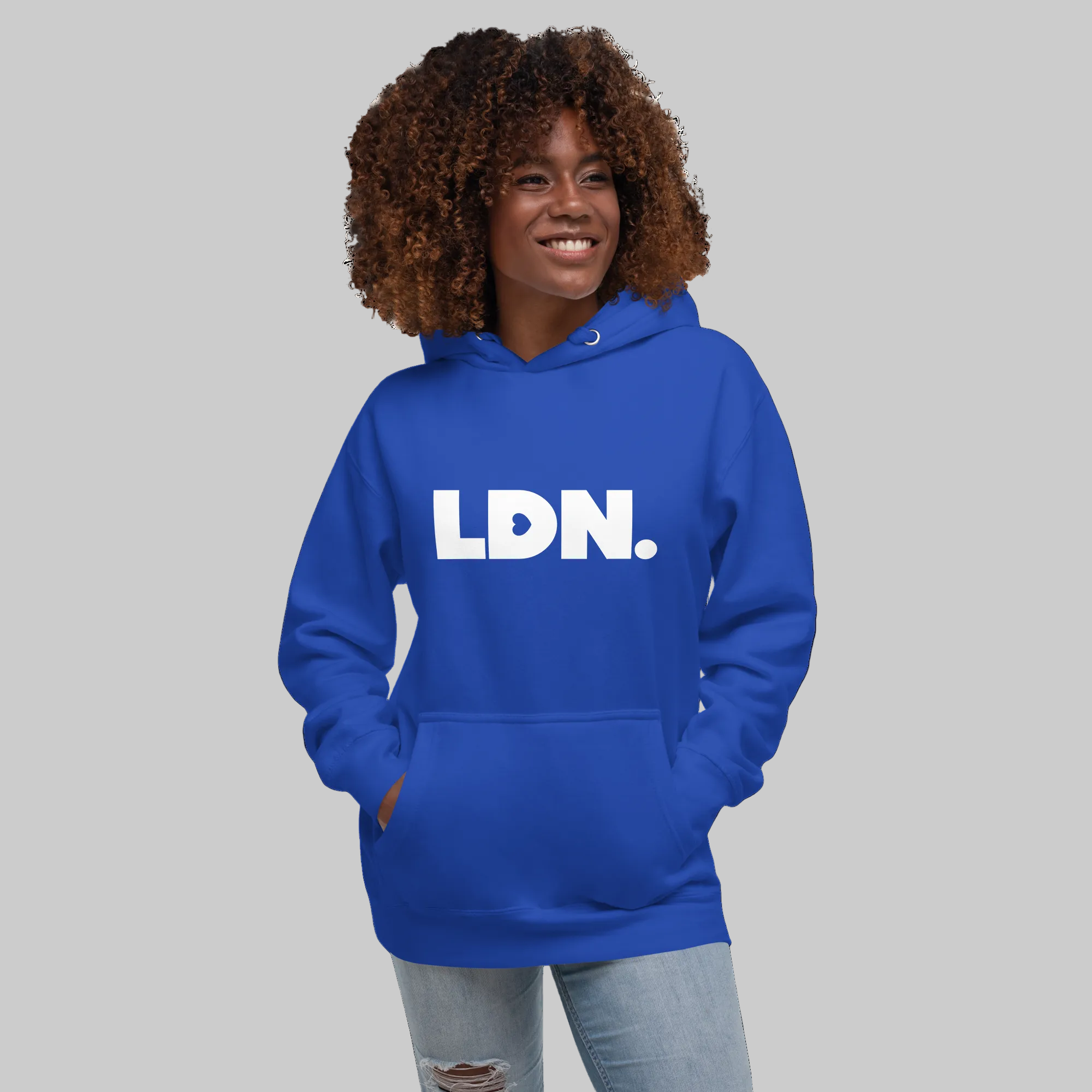 Unisex Hoodie - Blue hoodie with tonal “LDN.” graphic worn by female model — soft fleece lining, relaxed streetwear silhouette, perfect for layering in cooler seasons.