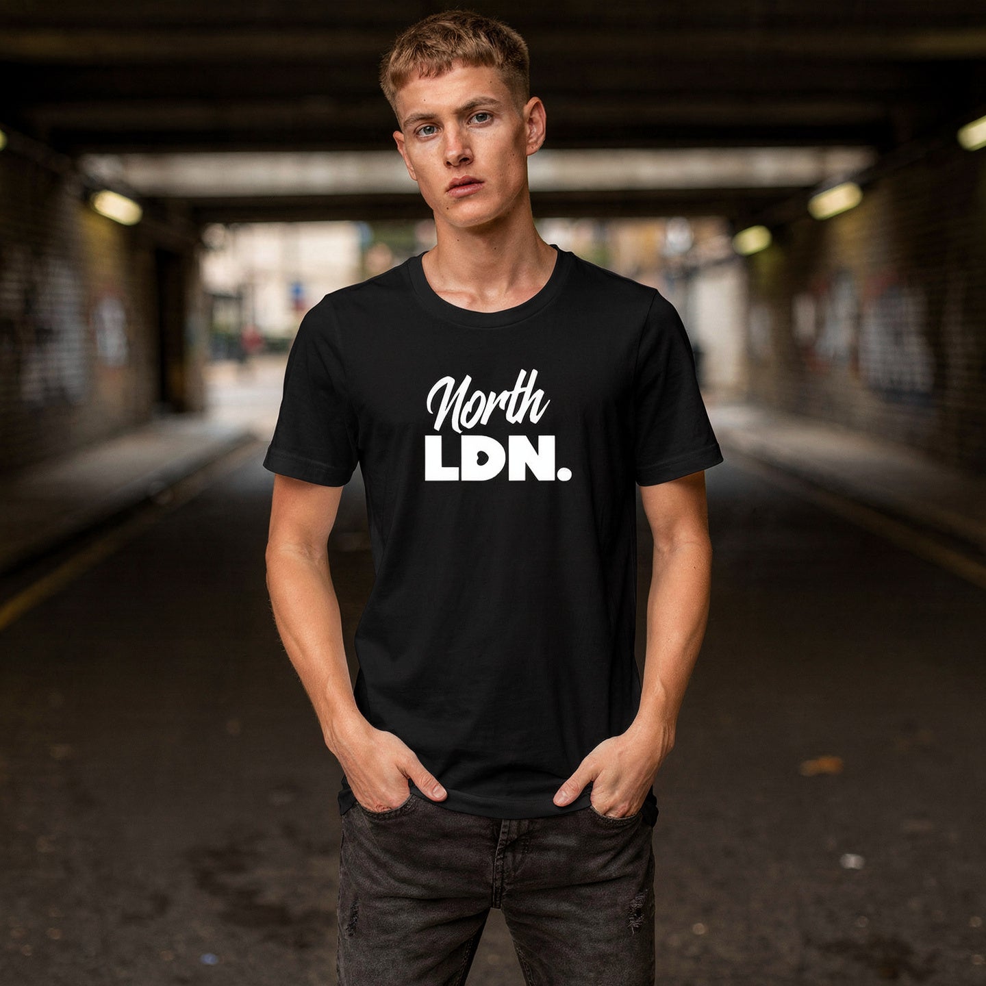 Model wearing a black t-shirt with 'North LDN.' text in an urban setting