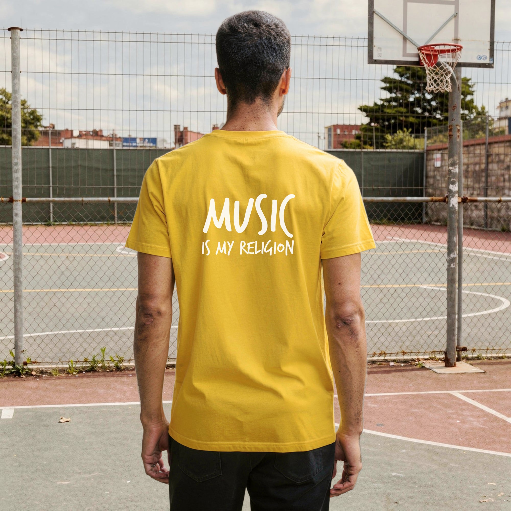 A bold "Music is My Religion" unisex t-shirt featuring a funky Jesus design in vibrant, geometric art. Made from 100% ring-spun cotton, this stylish shirt is perfect for music lovers, festival gear, and unique graphic tees that stand out.