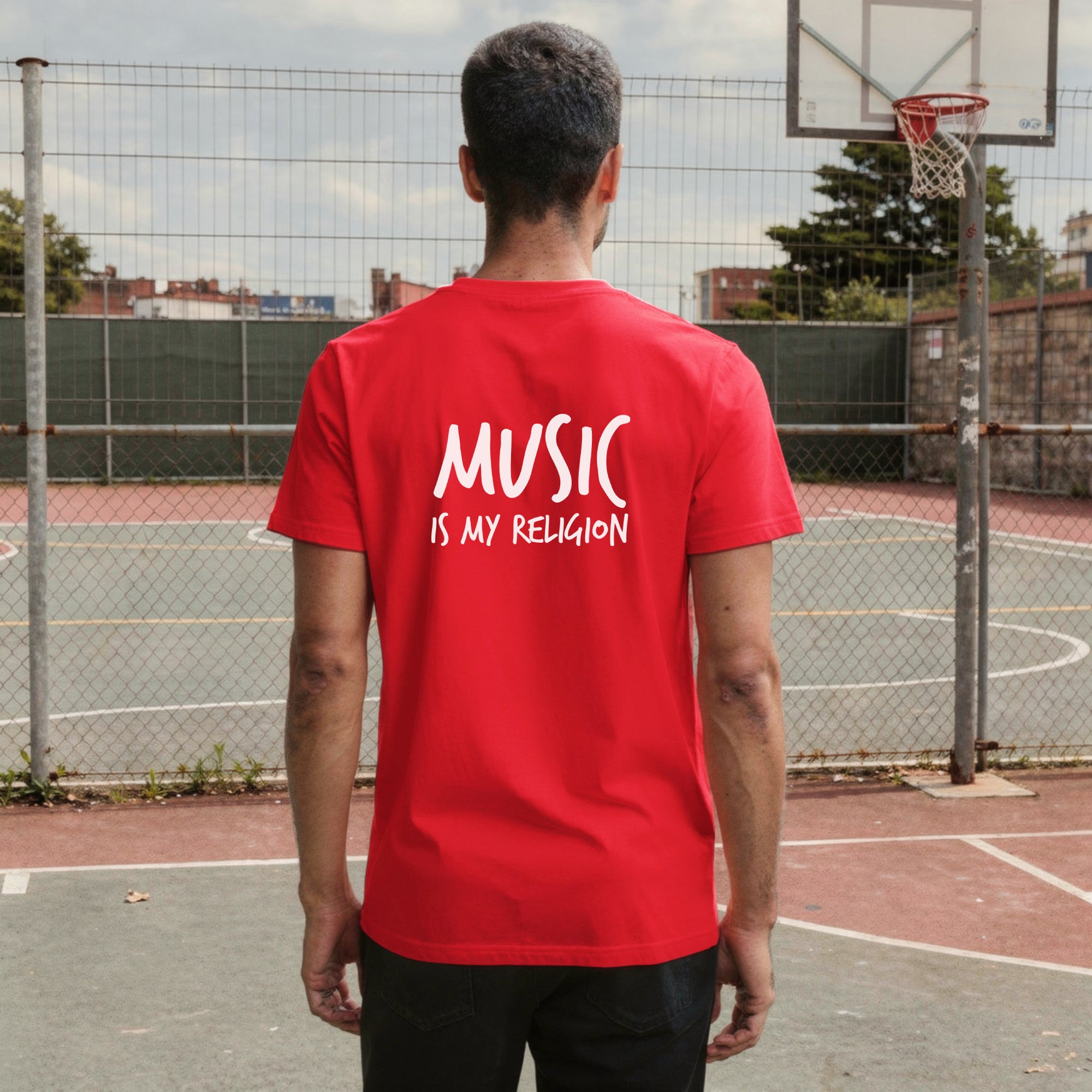 A bold "Music is My Religion" unisex t-shirt featuring a funky Jesus design in vibrant, geometric art. Made from 100% ring-spun cotton, this stylish shirt is perfect for music lovers, festival gear, and unique graphic tees that stand out.