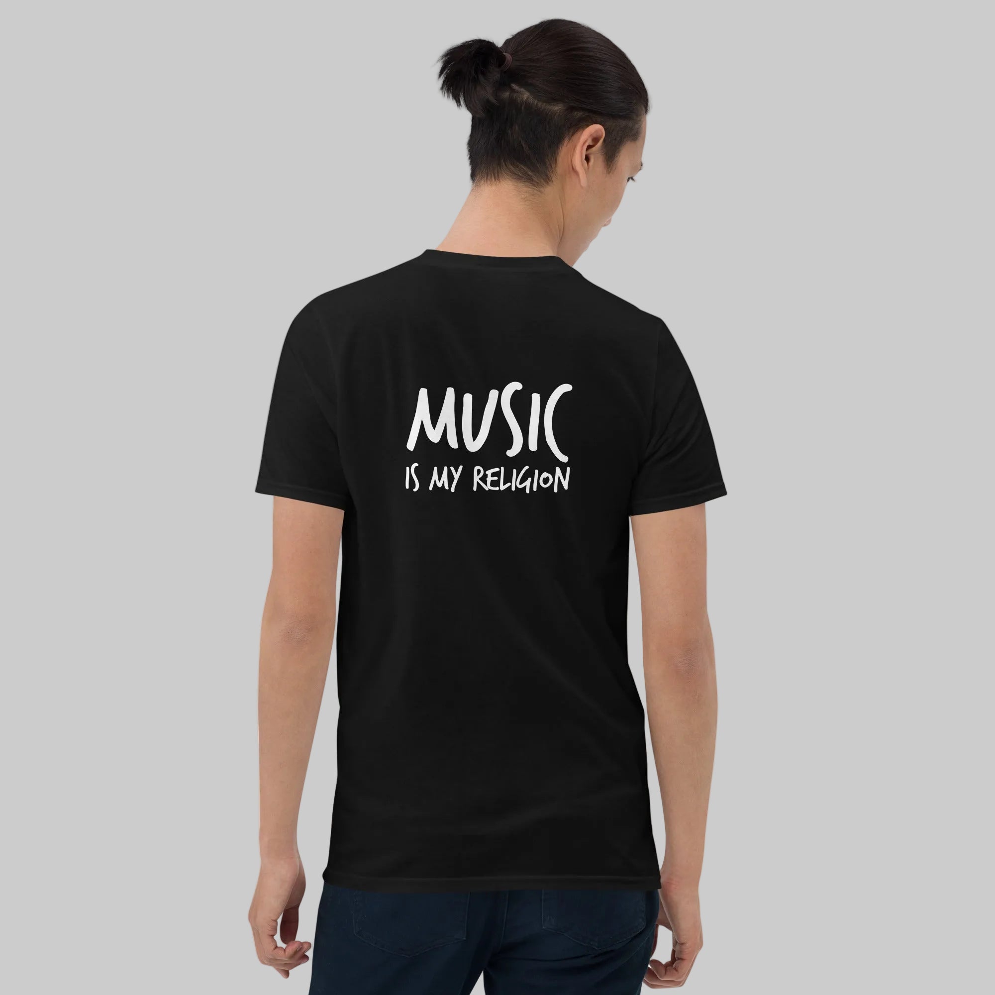 A bold "Music is My Religion" unisex t-shirt featuring a funky Jesus design in vibrant, geometric art. Made from 100% ring-spun cotton, this stylish shirt is perfect for music lovers, festival gear, and unique graphic tees that stand out.