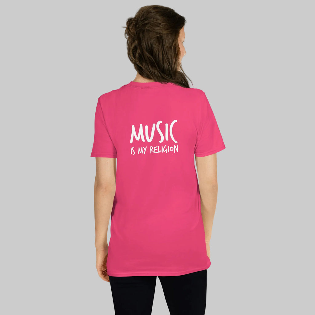 Person wearing a pink t-shirt with 'Music is my Religion' text on the back.