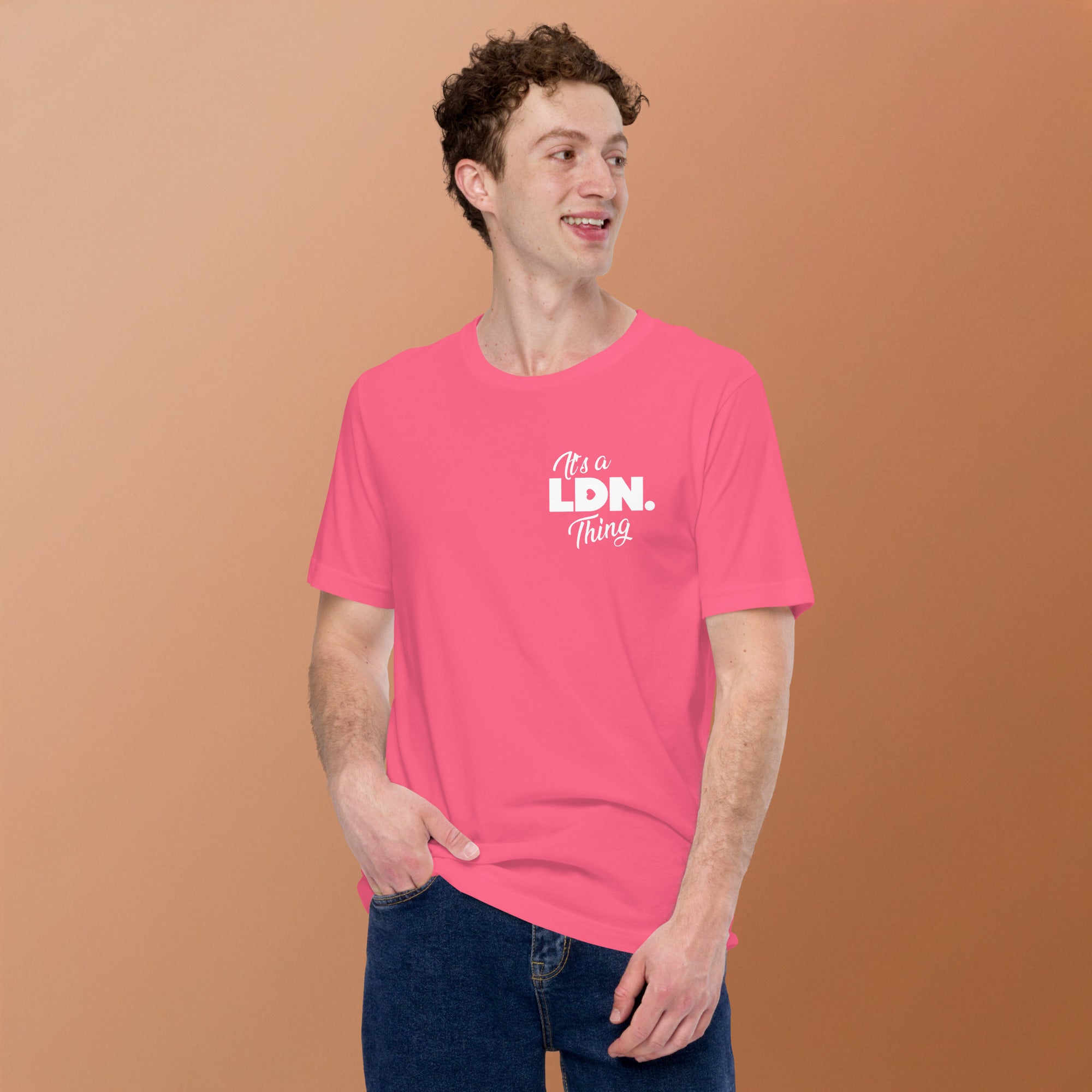 Person wearing a pink t-shirt with 'It's a LDN Thing' text on a brown background