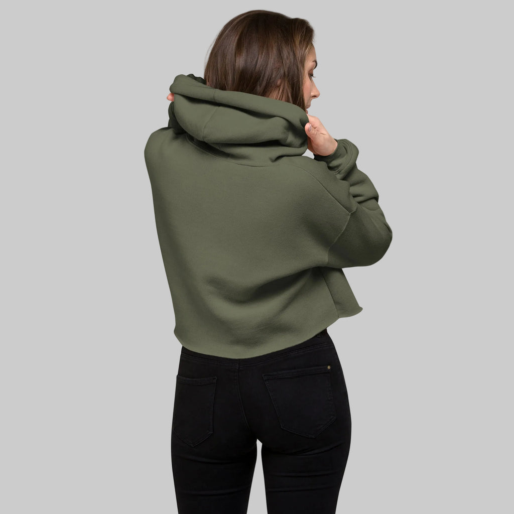 Model wearing a cropped hoodie with tonal “LDN.” graphic. Hoodie features dropped shoulders, raw hem, and dyed-to-match drawstrings. Made from cotton-poly fleece blend for soft comfort and relaxed fit. A minimal, modern streetwear piece.